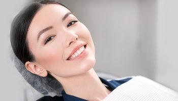 Four Reasons to Choose Dental Implants Over Bridges or Dentures