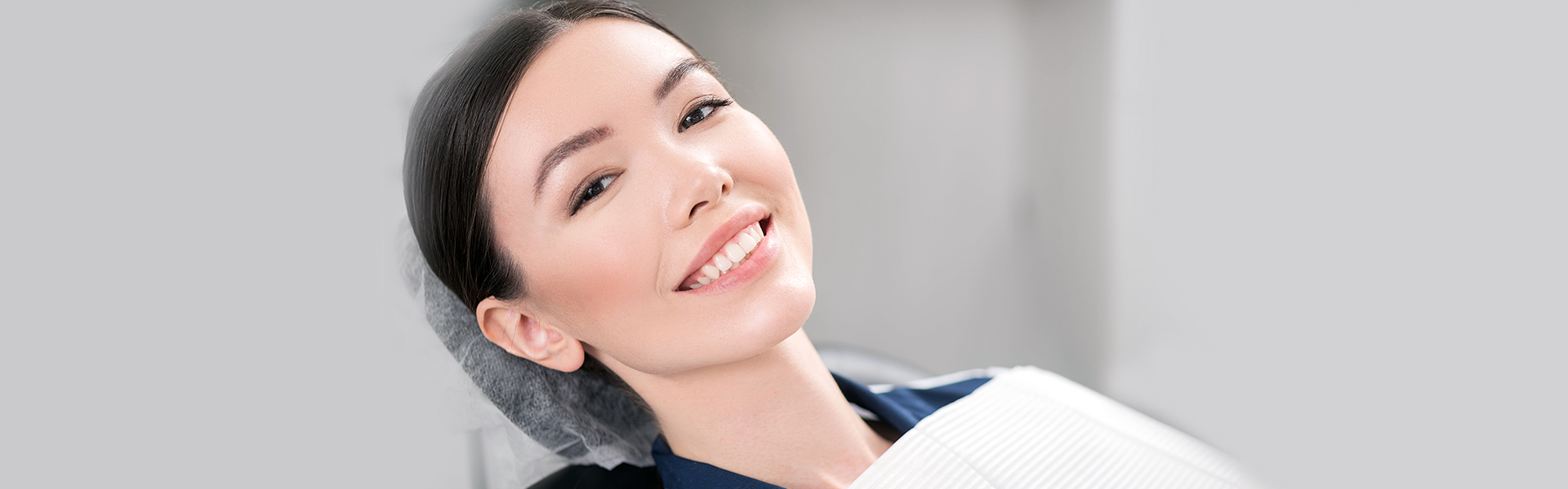 Four Reasons to Choose Dental Implants Over Bridges or Dentures